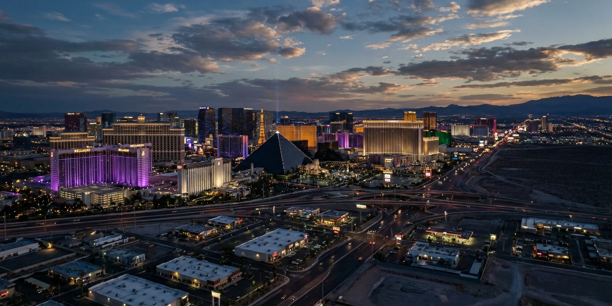 Aerial twilight view of Las Vegas skyline and the Strip stretching toward the Mojave Desert horizon