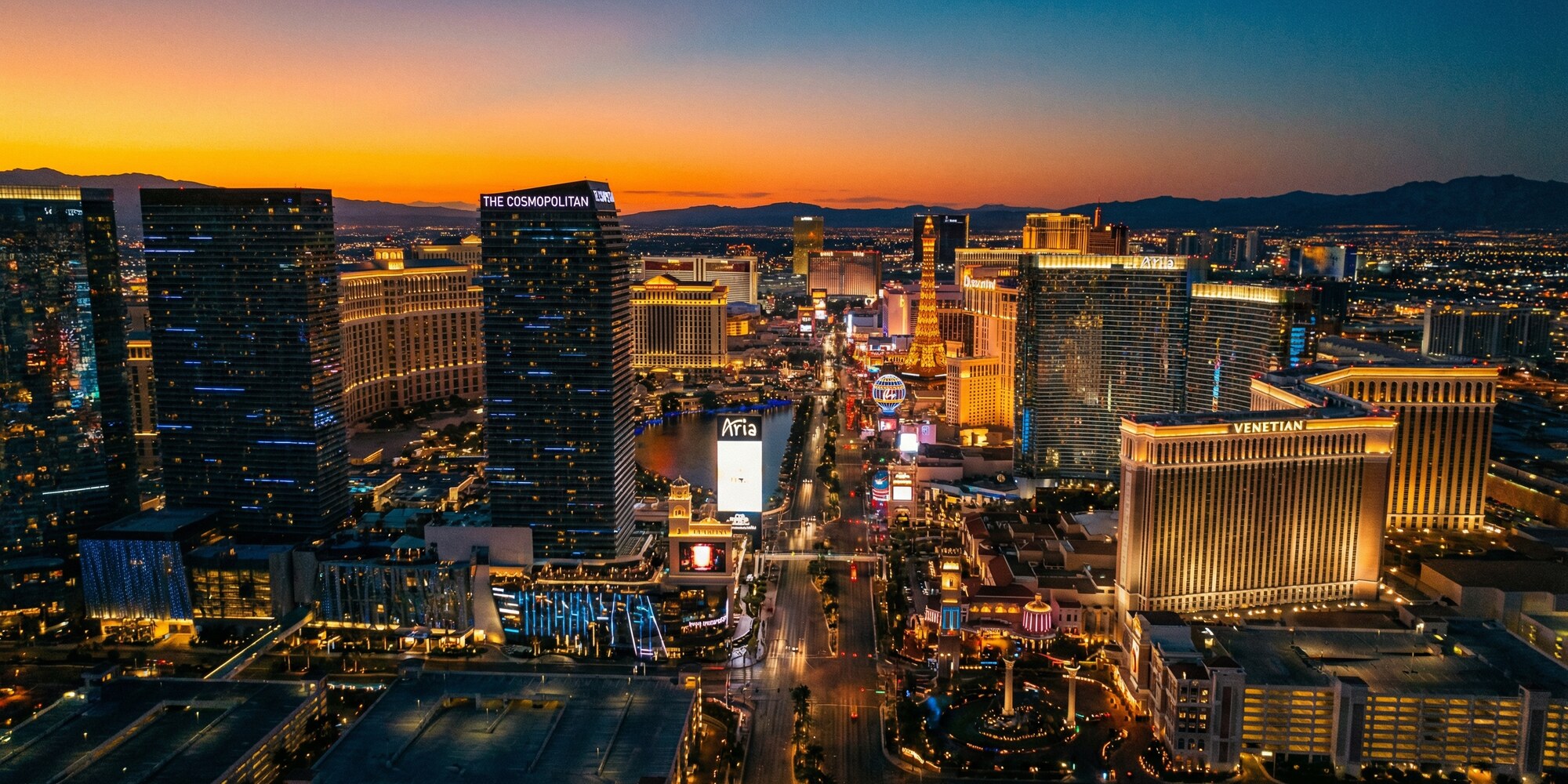 Las Vegas commercial district and hotel towers at dusk, aerial view